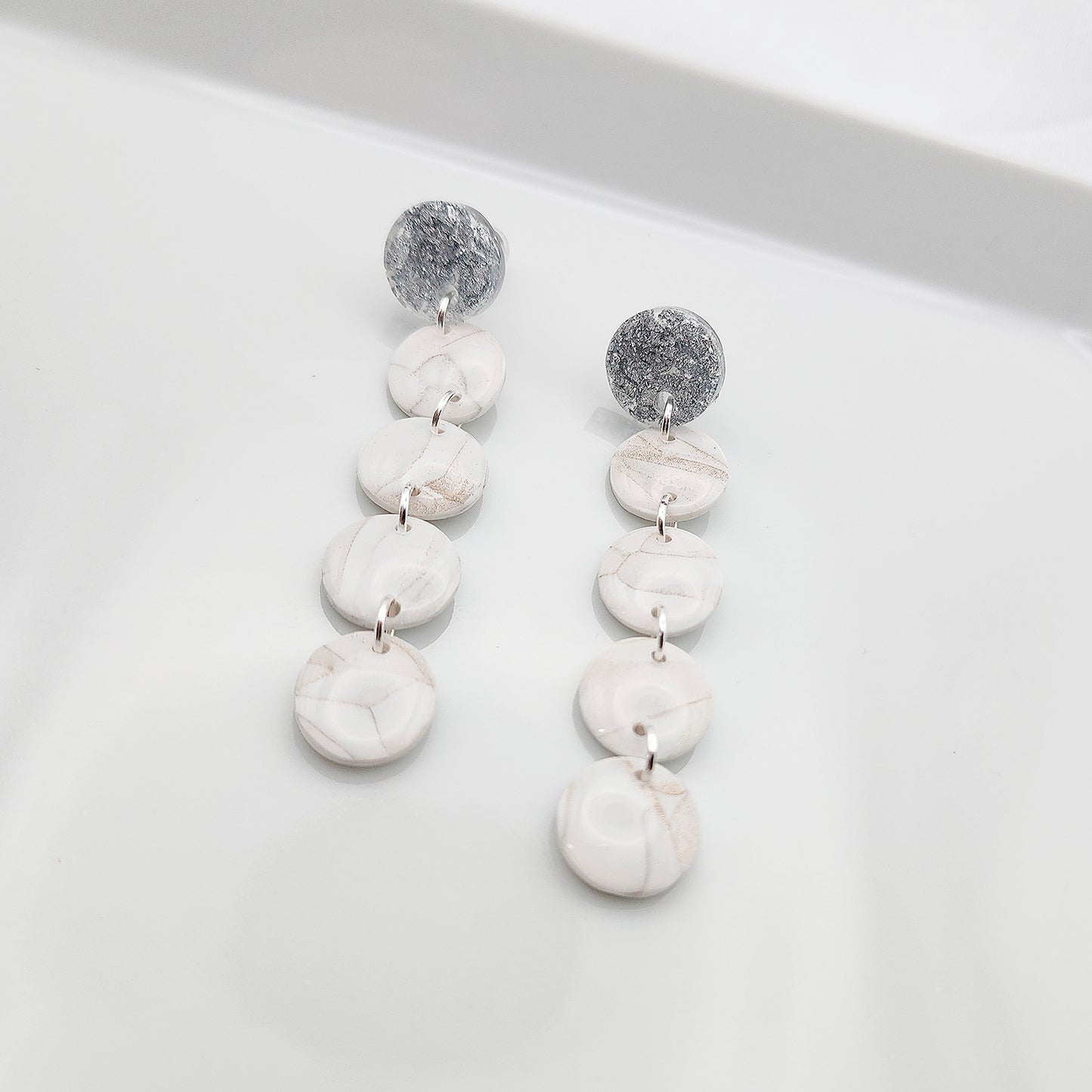 Dangle white earrings on silver studs