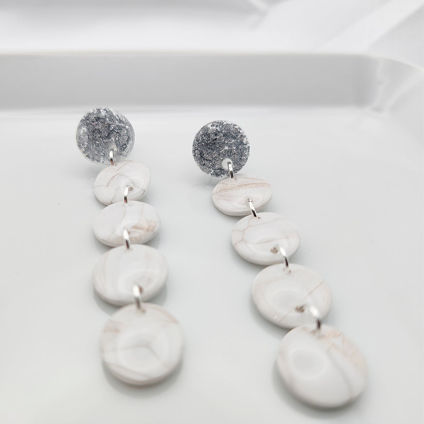 Dangle white earrings on silver studs