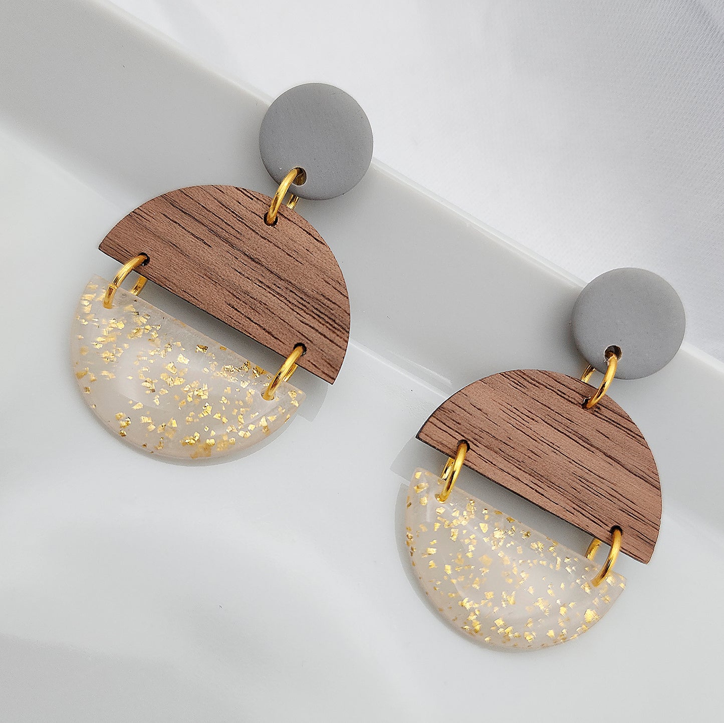 Dangle wood semicircles and transparent with gold shimmer earrings