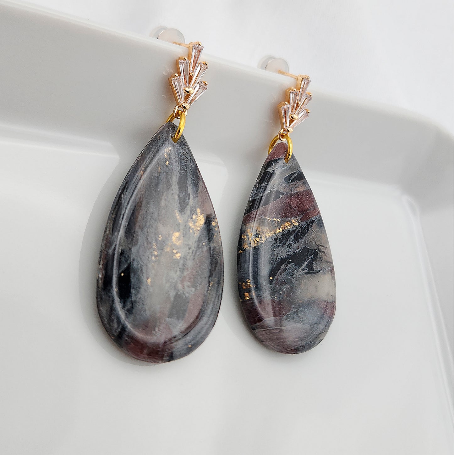 Dangle black stone clay earrings on gold studs