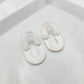 Oval dangle white earrings with silver shimmer