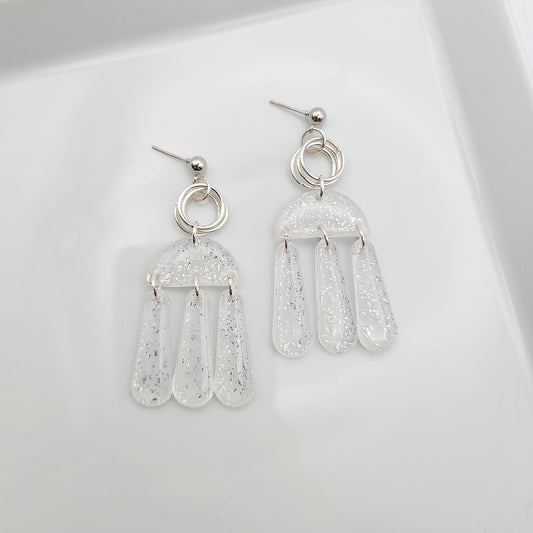 Dangle translucent earrings with silver shimmer