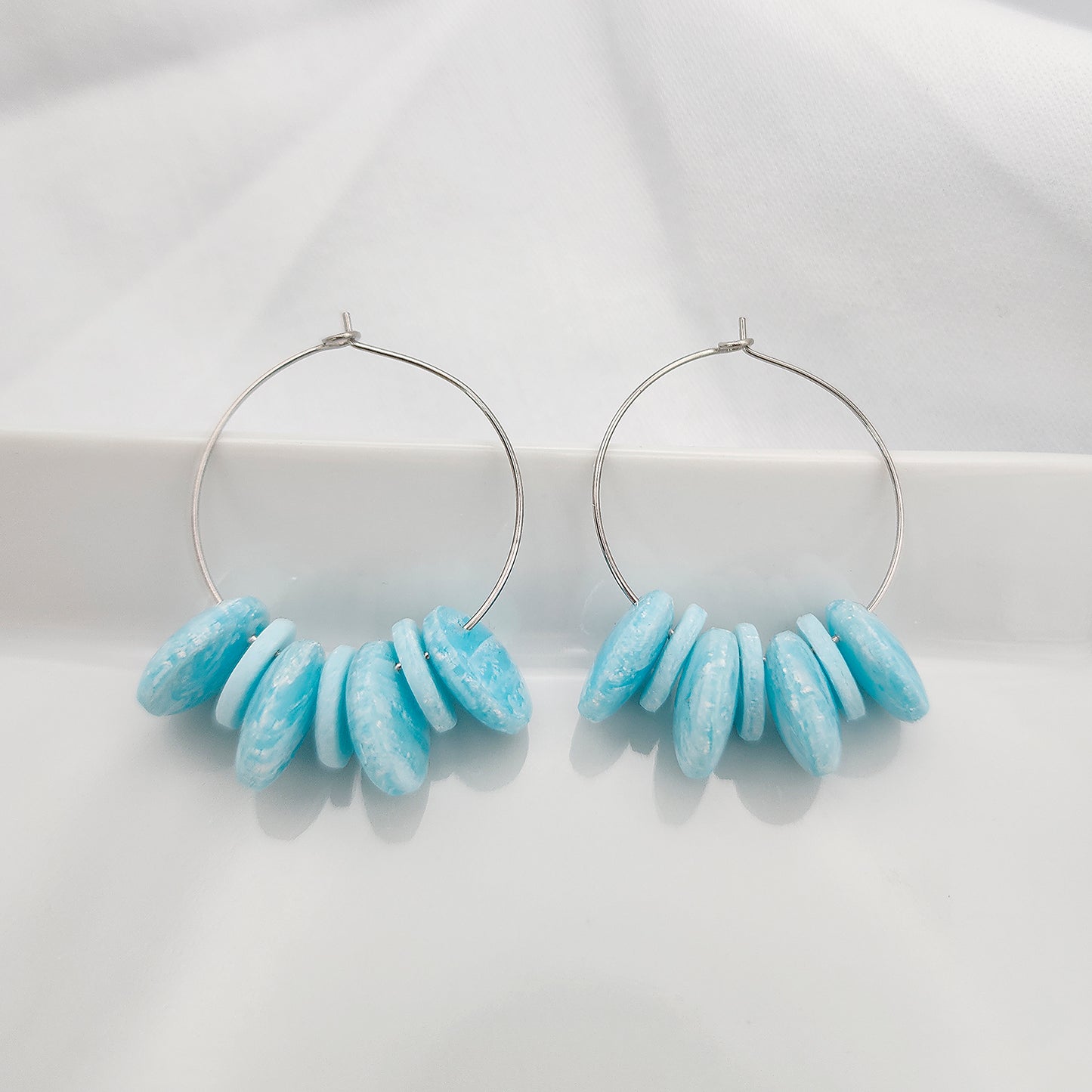 Hoop earrings with blue beads