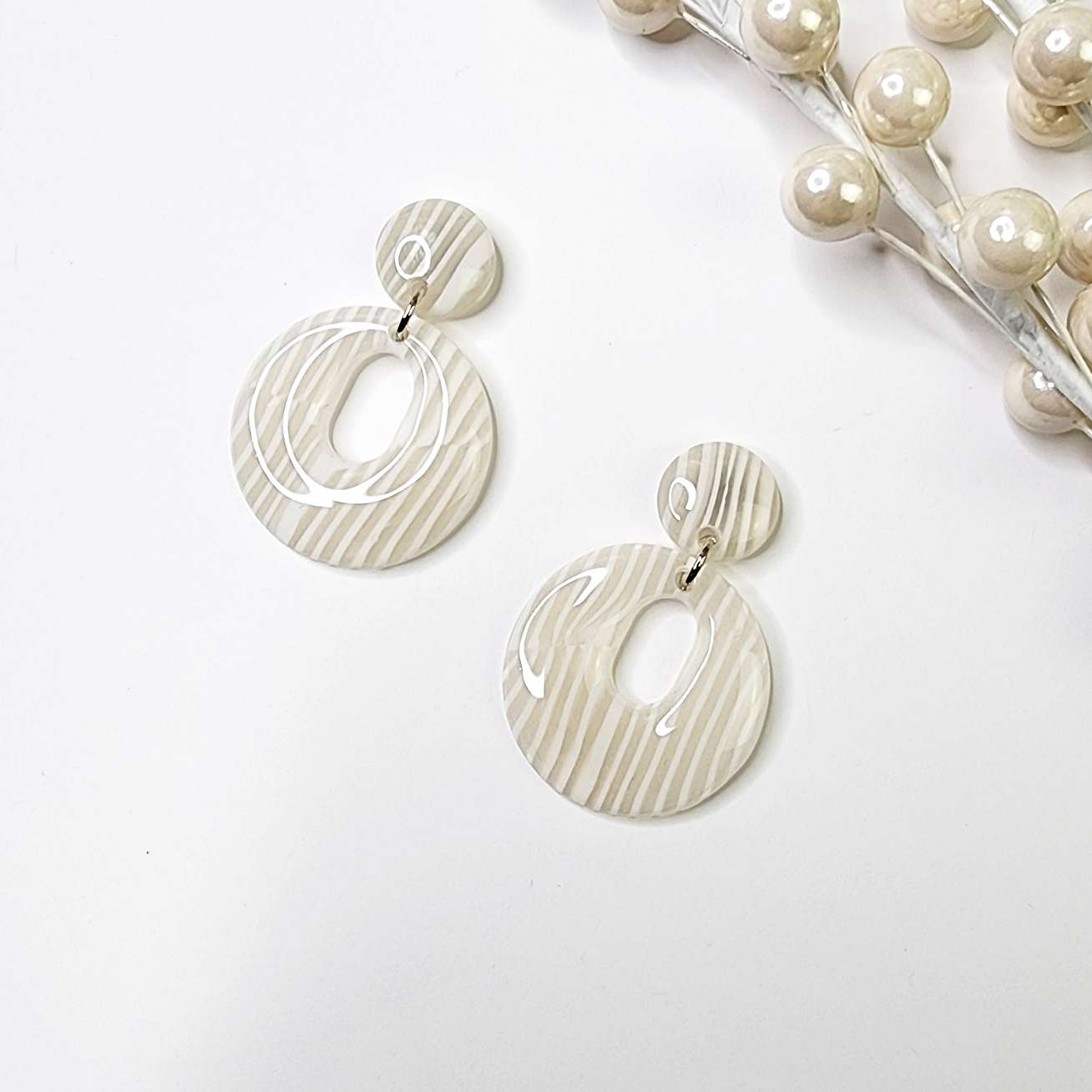 Hoop earrings in retro shape 60s style, ivory stripes