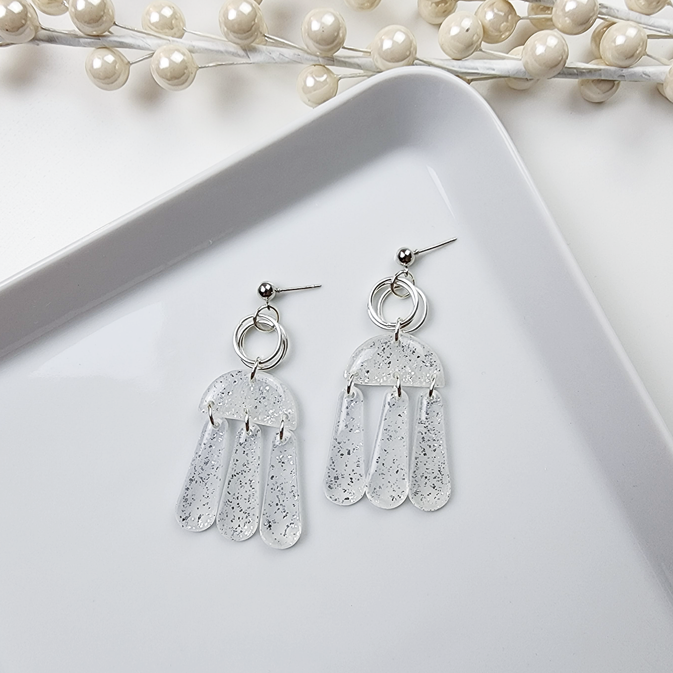 Dangle translucent earrings with silver shimmer