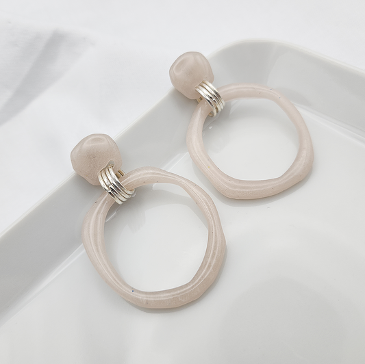 Statement dangling beige hoop earrings