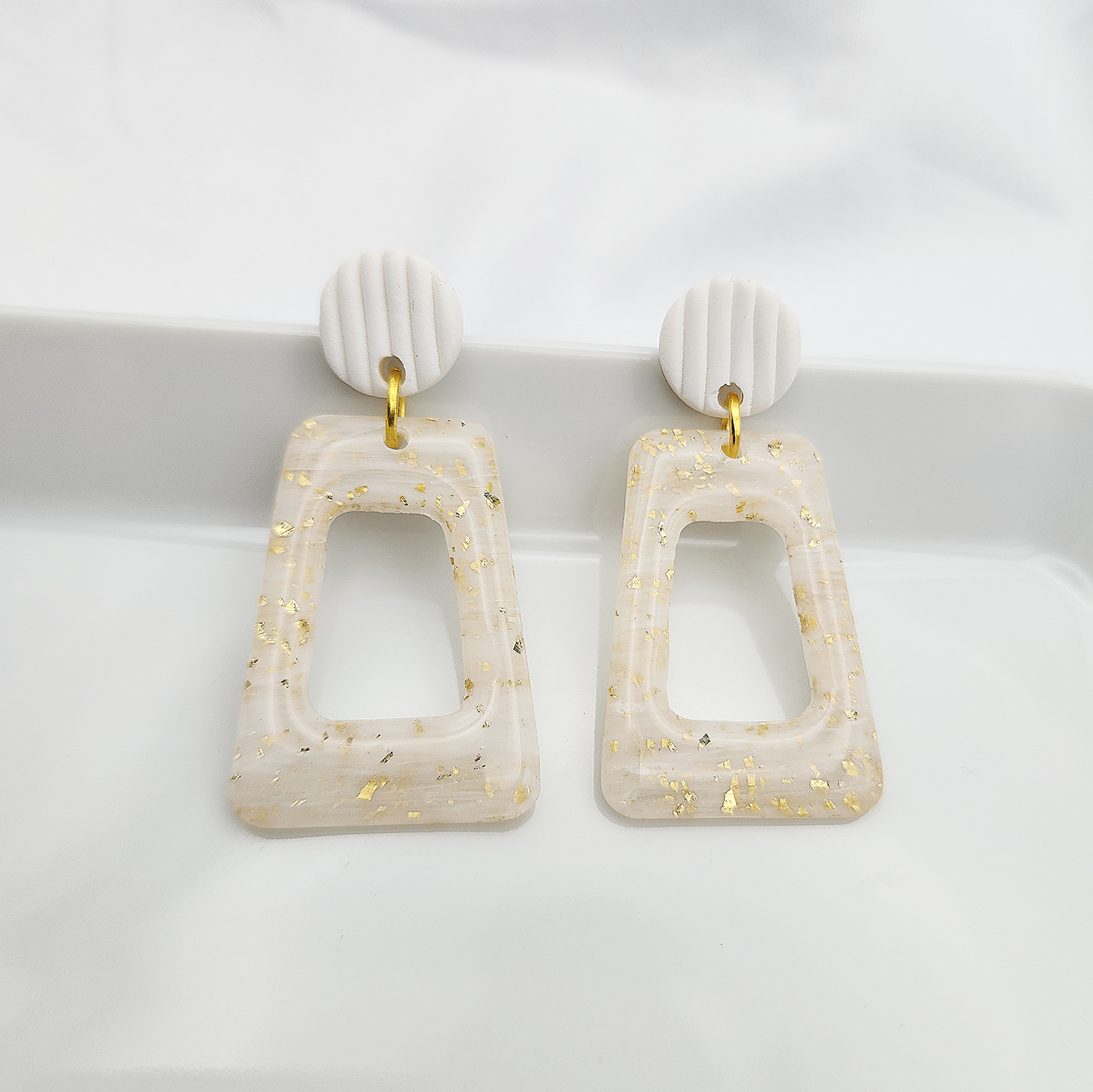 Translucent arch earrings with gold foil