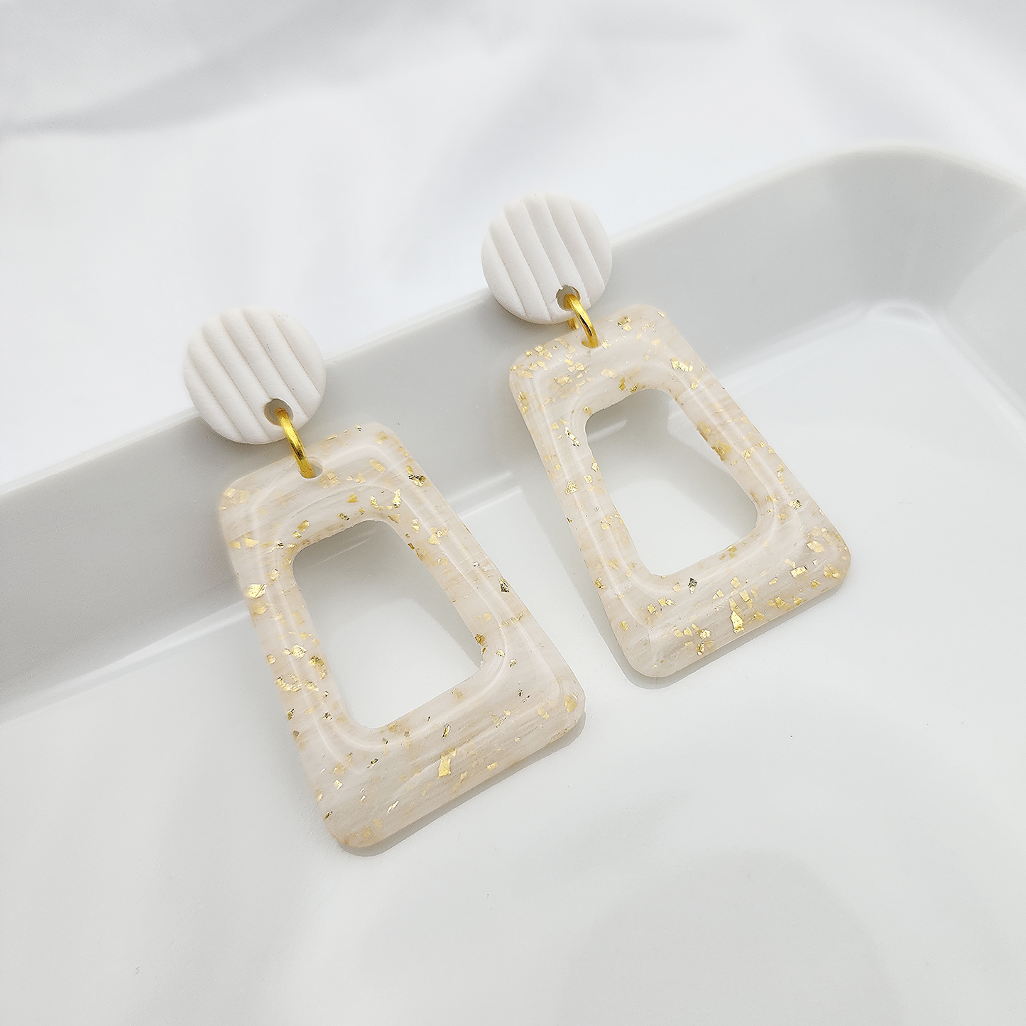 Translucent arch earrings with gold foil